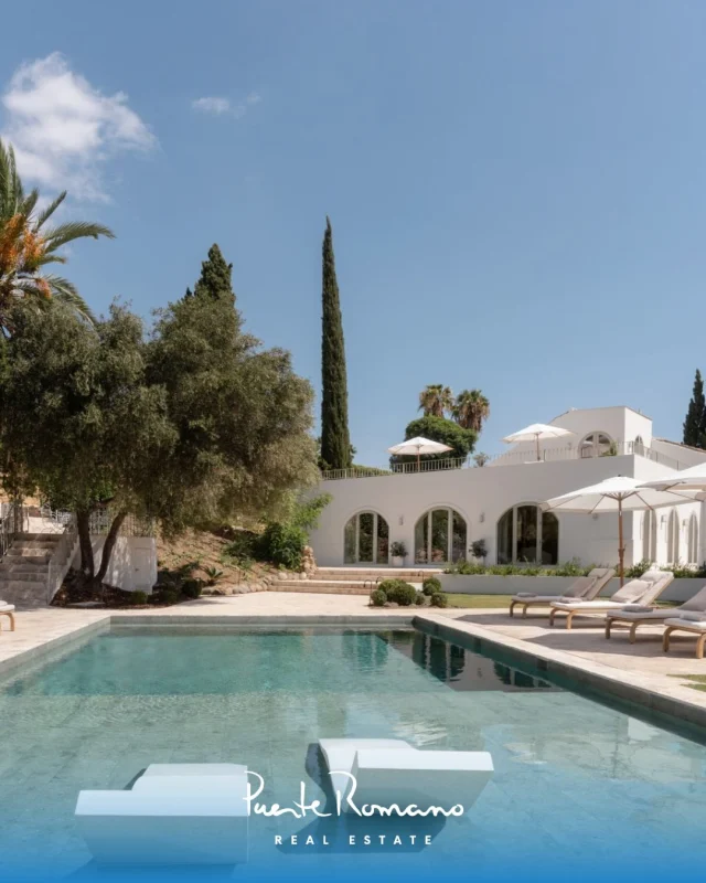 Villa Blanc: Stunning family home on a double plot in Nueva Andalucía.Asking price: €3,495,000❈ 1,912 m² double plot with mature gardens and palms❈ 388 m² total built area with 93 m² of terraces❈ Four en-suite bedrooms plus guest toilet❈ Southwest orientation with mountain and sunset views❈ Saltwater pool, pool house with BBQ and lounge❈ Rooftop terrace overlooking Los Naranjos Golf❈ Private garage and long gated drivewayEnergy Rating: In processLocation: Nueva Andalucía, MarbellaReference: 16726More information: prre.link/16726Contact us to arrange a viewing.#PuenteRomanoRealEstate #NuevaAndalucia #MarbellaRealEstate